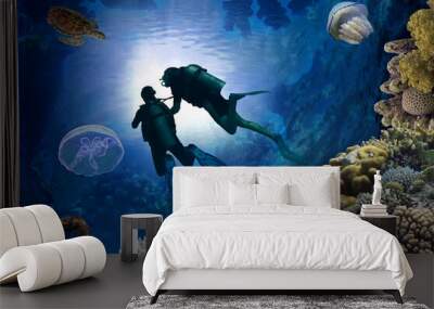 Two Scuba Divers  silhouette against sunburst  beside a coral reef Wall mural