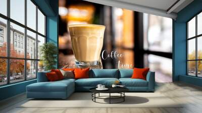 Coffee time. Time for me. Glass with coffee on a wooden table. Cappuccino with almond milk. Vegetarian drink. Relax with a cup of coffee. Latte by the window Wall mural