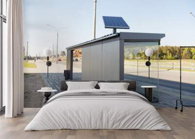 Set of solar panels on contemporary bus stop on street Wall mural