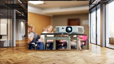 Screen projector. the projector is showing video. digital video projector on a stand, rear view. video projector at a business conference, seminar or lecture in the office, on a stand. Wall mural