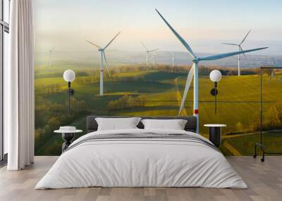 Panoramic view of wind farm or wind park, with high wind turbines for generation electricity with copy space. Green energy concept. Wall mural