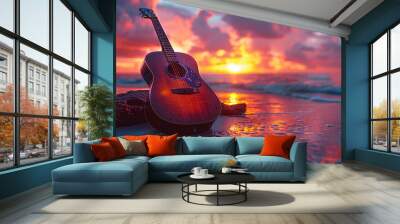 A peaceful scene on the beach at sunset, with an acoustic guitar leaning against a log Wall mural