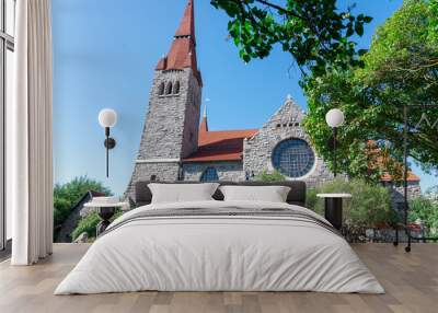 An ancient castle with a beautiful garden and an old Catholic church. Wall mural