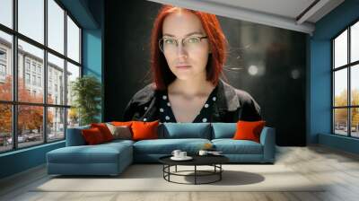 Portrait of beautiful redhead woman wearing glasses. Wall mural