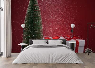 White gift boxes and fir tree on red background. Copy spase for text Wall mural