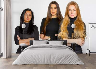 three young female friends pose together in the Studio. women employees of a beauty salon Wall mural