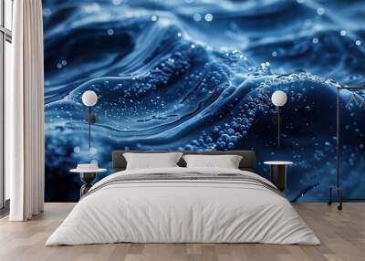 Closeup view of electric blue water surface with rippling waves and bubbles Wall mural