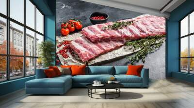 Fresh raw lamb spare ribs with spices and herbs. Black background. Top view Wall mural