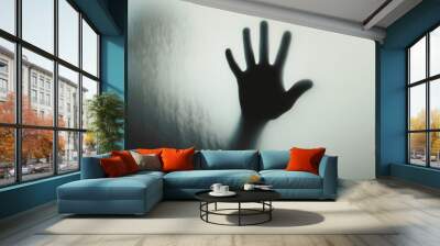 Hand silhouette on grey background. Blurred human hand shape out of focus Wall mural