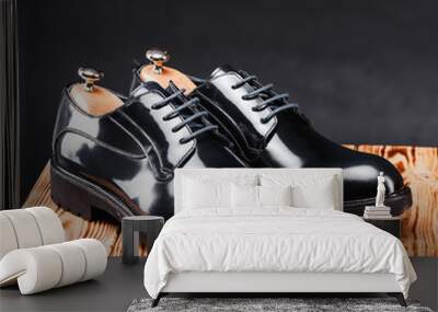 leather stylish men's shoes on a black background Wall mural