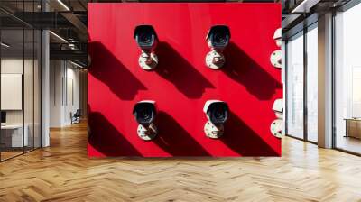 Many security cameras on a red wall. Protection and safety. CCTV surveillance cameras Wall mural