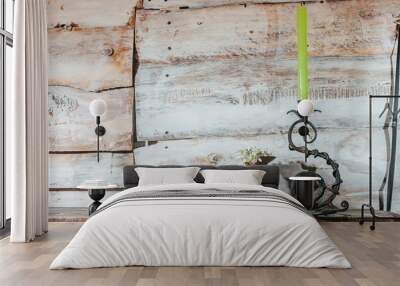 Old wooden background with snowdrop and Old forged candlestick Wall mural