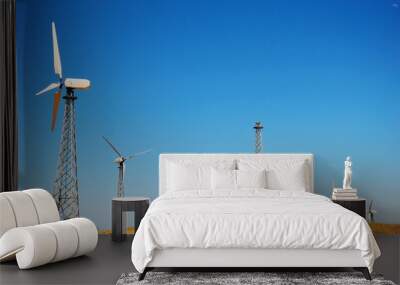 Wind power station against a clear blue sky Wall mural