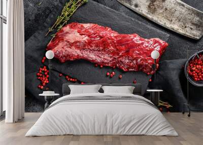 Raw skirt, machete steak with pink pepper and thyme. Black background. Top view Wall mural