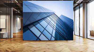 perspective, the skyscraper is directed to the sky. blue gradient, light reflection in glass, urban building design Wall mural