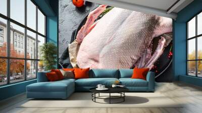 Recipe for cooking whole duck with pink pepper and rosemary. Black background. Top view. Space for text Wall mural