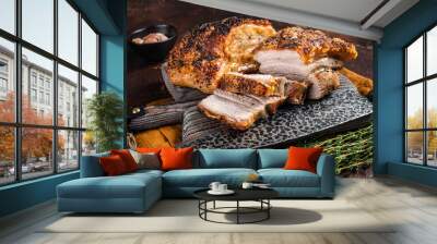 Roasted Pork belly bacon with crust on a wooden board. Dark background. Top view Wall mural