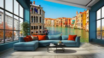 Grand Canal with gondolas in Venice, Italy. Gondolier carries tourists on gondola along the Grand Canal. Wall mural