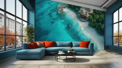 Tranquil beachfront villa on a secluded tropical island surrounded by turquoise waters and lush greenery Wall mural