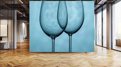 Two glasses for wine on a blue background
 Wall mural