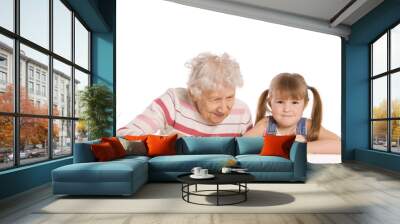 Grandmother with the grand daughter read Wall mural