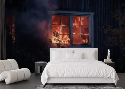 Windows of the burning house. Fire in the house. Burning building in the flames of fire at night Wall mural