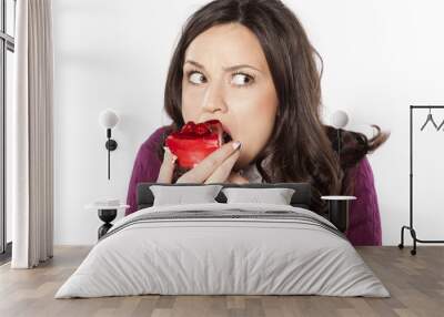 beautiful young woman eating cake secretly Wall mural