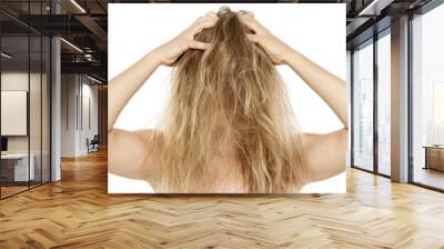 Blonde with messy hair, scratching her scalp Wall mural