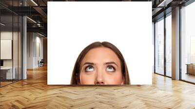 half portrait of a young girl looking up on white background Wall mural