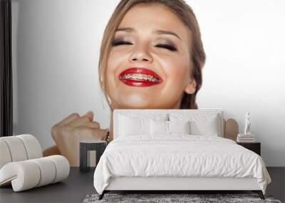 portrait of a young smiling beautiful woman with a braces Wall mural