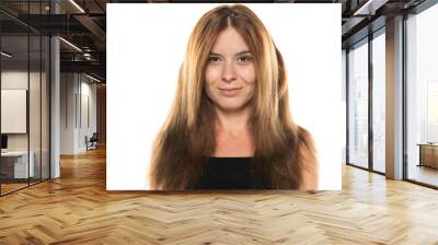 portrait of a young smiling woman without make up and with long hair on a white background Wall mural