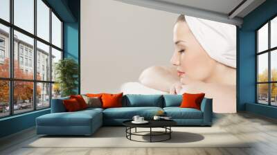 Profile of a beautiful young woman with a towel on her head Wall mural