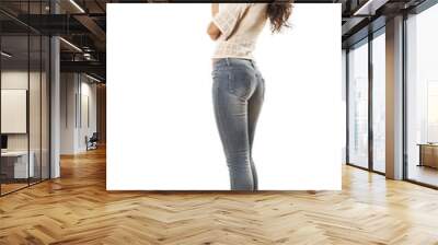 side view of smiling young woman in jeans posing on white Wall mural