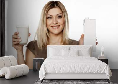 smiling young woman holding a glass of milk and Cardboard packaging Wall mural