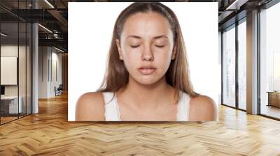 smiling young woman without make-up, looking at the camera Wall mural