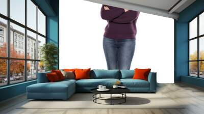 young smiling woman in a purple sweater and jeans with crossed arms Wall mural