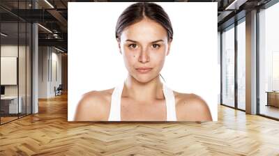 young woman without make-up with blank expression Wall mural