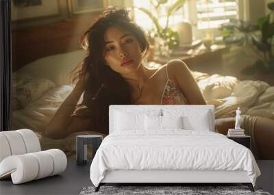 Beautiful Asian girl lying on bed in bra. Old style shot. Morning time Wall mural