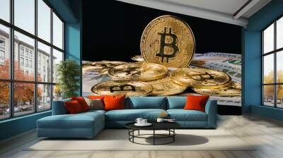 Close-up of metallic shiny bitcoin cryptocurrency coins. Crypto Bitcoin, virtual money and hundred dollar bills. Exchange dollar for bitcoin. Golden Bitcoin. Wall mural