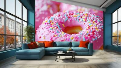 Close-up of pink doughnuts with colorful sprinkles Wall mural