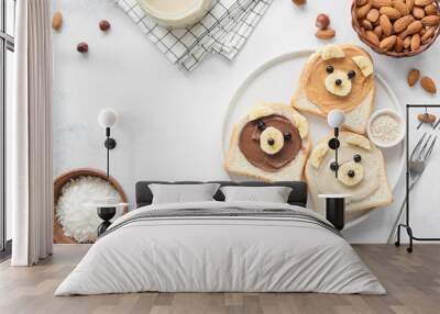 Animal face breakfast toasts with nut butter for kids on concrete background with copy space for text. Food art, kids menu or healthy vegan snack for children concept Wall mural