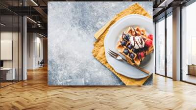 Belgian waffles with berries and ice cream, top view and copy space for text. Sweet breakfast concept Wall mural