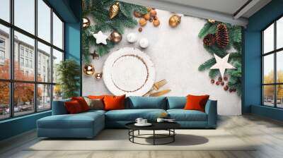 Christmas or New Year table setting mock up or frame with copy space for design elements and text. Top view. Empty plate, cutlery, fir tree and Christmas toys Wall mural