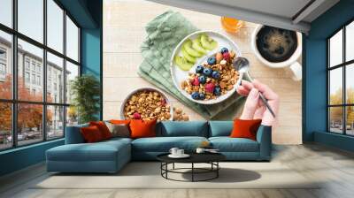 Granola yogurt bowl with fruits and berries for healthy breakfast Wall mural