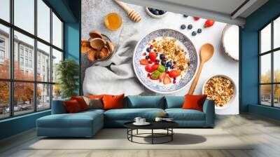 Healthy breakfast bowl granola fruits and berries. Vegetarian meal, concept of dieting, weight loss, healthy lifestyle and eating Wall mural