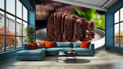 Slice of chocolate cake with glaze on a plate Wall mural