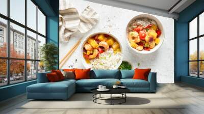 White rice in bowl with pineapple shrimp curry on grey concrete table background, top view Wall mural