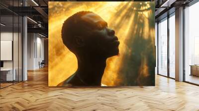 Silhouette of a black man holding the sun Wall mural