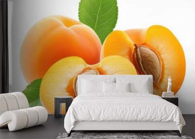 Two fresh apricots, peaches with leaves and one cut in half on a white background. Wall mural