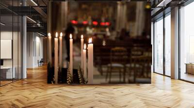 Burning candles in church, shallow depth of field Wall mural